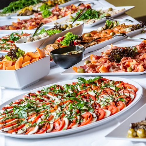 Party Brunch big Buffet table setting with Food Meat Vegetables